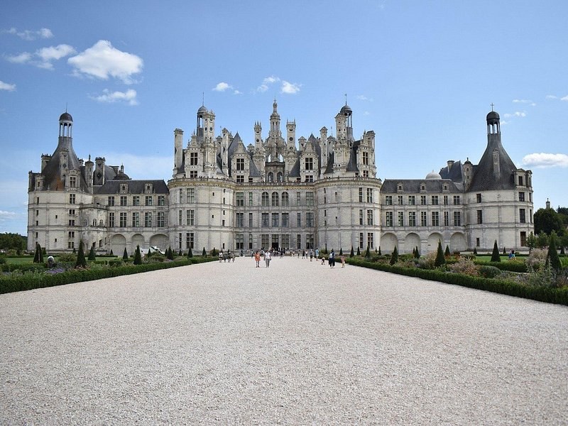 The façade of Château de Chambord at the end of its gravel approach