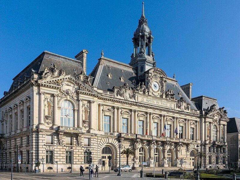 The Hôtel de Ville of Tours, its clock tower against a blue sky